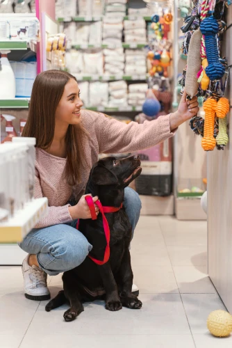 Woman and dog in pet store